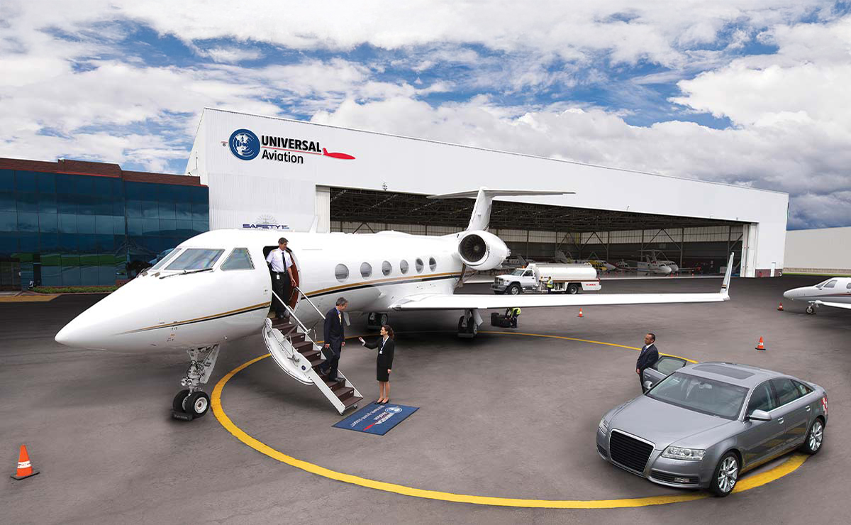 Private jet and ground transportation in front of a Universal Weather Aviation branded hangar