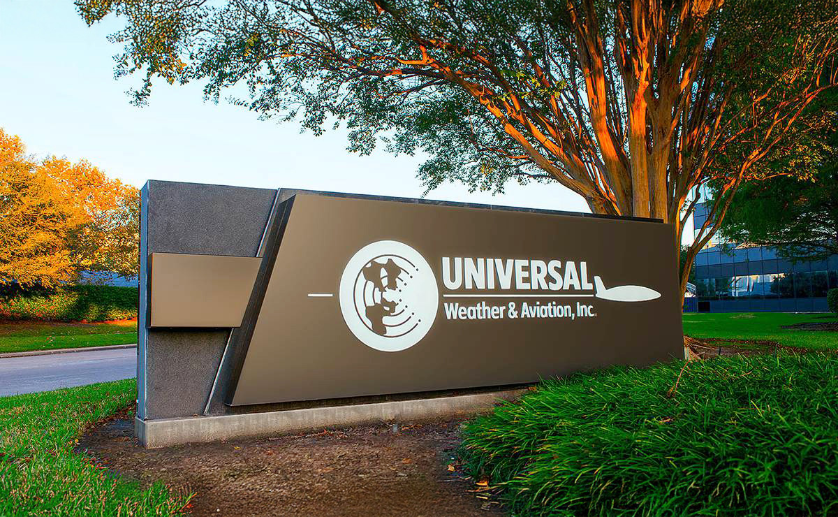 Universal Weather and Aviation, Inc sign in front of headquarter building in Houston, TX